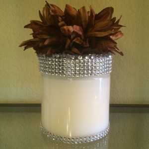 29 oz Candle with a Gold Flower Wrapped in Silver Bling